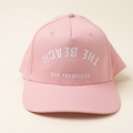 The Beach SF pink Flip hat on an off-white background