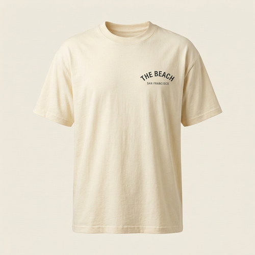 Cream men's tee with dark The Beach chest logo, front